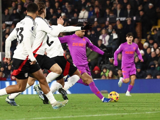 Joao Gomes of Wolverhampton Wanderers scores a goal and celebrates during his side's match against Fulham, on November 23, 2024