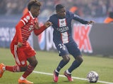 Nuno Mendes of Paris Saint Germain and Kingsley Coman of Bayern Munich on February 14, 2023