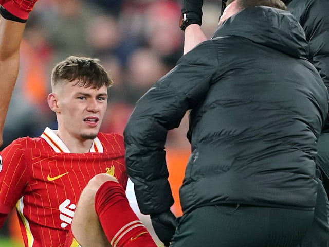 Liverpool's Conor Bradley receives treatment for an injury on November 26, 2024