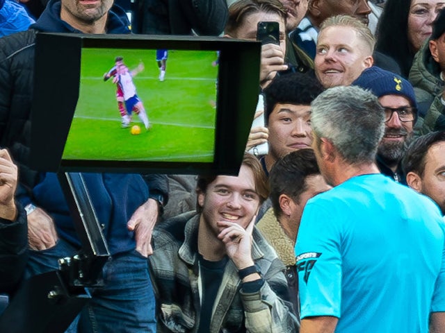 Referee Darren Bond looks at the monitor before sending off Fulham's Tom Cairney on December 1, 2024