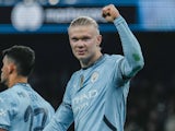 Manchester City striker Erling Haaland scores a penalty and celebrates on November 26, 2024