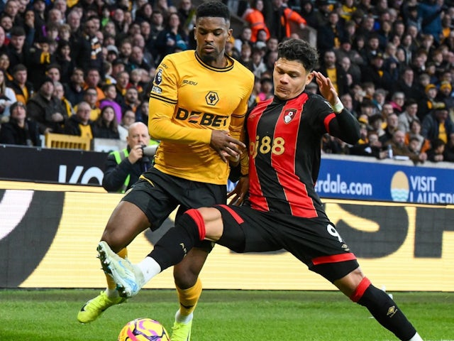 Nelson Semedo (left) of Wolverhampton Wanderers and Evanilson (right) of Bournemouth battle for the ball, on November 30, 2024