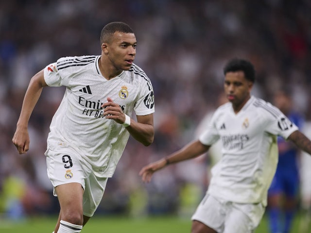 Real Madrid's Kylian Mbappe celebrates scoring against Getafe on December 1, 2024