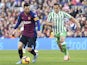 Lionel Messi of Barcelona and Andres Guardado of Real Betis on November 11, 2018