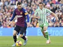 Lionel Messi of Barcelona and Andres Guardado of Real Betis on November 11, 2018