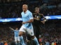 Juventus' Paul Pogba looks on as Manchester City's Vincent Kompany celebrates on September 15, 2015