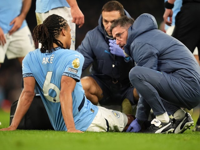 Manchester City's Nathan Ake receives treatment for an injury on December 4, 2024