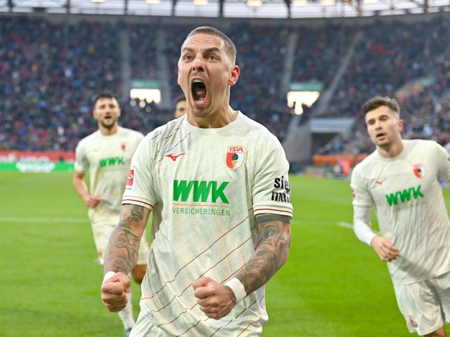 Phillip Tietz celebrates scoring for Augsburg on November 30, 2024