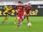 Bayern Munich's Robert Lewandowski scores the winning goal against Borussia Dortmund on December 4, 2021