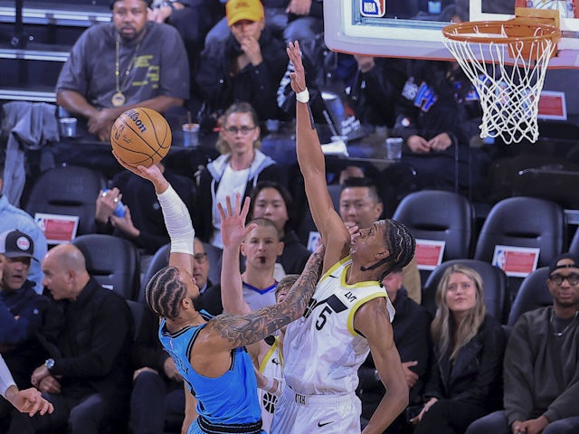 Cody Williams 5 of the Utah Jazz tries to block a shot by Amir Coffey 7 of the Los Angeles Clippers on December 5, 2024