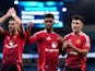 Manchester United's Amad Diallo celebrates with Lisandro Martinez and Diogo Dalot on December 15, 2024