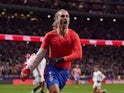 Atletico Madrid's Antoine Griezmann celebrates after scoring on December 8, 2024