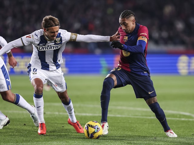 Leganes' Sergio Gonzalez in action with Barcelona's Raphinha on December 15, 2024