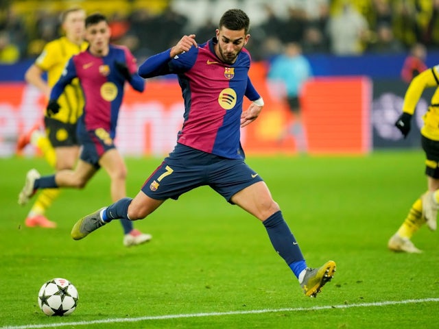 Ferran Torres of Barcelona scores his team's third goal against Borussia Dortmund, on December 11, 2024