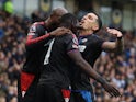 Crystal Palace's Daniel Munoz, Ismaila Sarr and Jean-Philippe Mateta celebrate on December 15, 2024