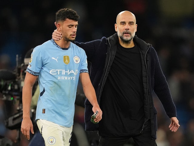 Manchester City's Matheus Nunes with manager Pep Guardiola on December 15, 2024