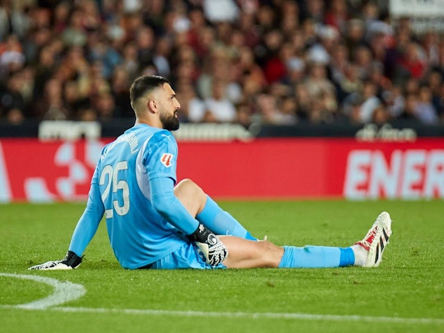 Giorgi Mamardashvili of Valencia injured during his side's match against Rayo Vallecano, on December 7, 2024