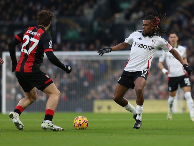 Alex Iwobi of Fulham and Illya Zabarnyi of Bournemouth during their side's clash, on December 29, 2024