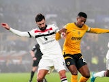 Manchester United's Bruno Fernandes (left) and Wolverhampton Wanderers' Nelson Semedo battle for the ball during their side's clash, on December 26, 2024