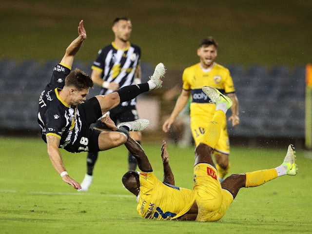 Walter Scott of Macarthur FC and Brian Kaltak of Central Coast Mariners collide 