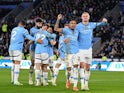 Erling Haaland celebrates with his Manchester City teammates after scoring on December 29, 2024