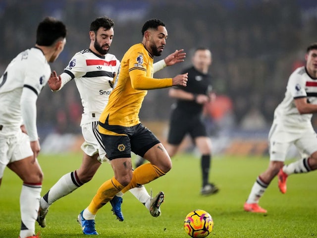 Manchester United's Bruno Fernandes (centre left) fouls Wolverhampton Wanderers' Matheus Cunha, on December 26, 2024