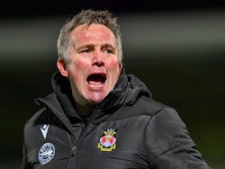 Wrexham manager Phil Parkinson thanks fans after his side's match against Burton Albion, on December 7, 2024