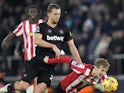 West Ham United's Tomas Soucek (left) and Southampton's Flynn Downes battle for the ball during their side's clash, on December 26, 2024