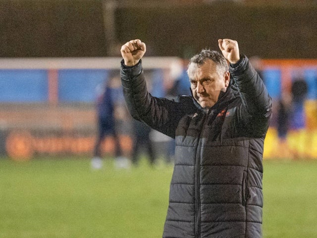 Oldham Athletic manager Micky Mellon applauds fans after his side's match against Braintree Town, on December 21, 2024