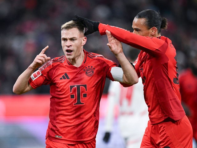 Bayern Munich's Joshua Kimmich celebrates with Leroy Sane on December 20, 2024