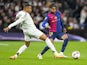 Real Madrid's Kylian Mbappe in action with Barcelona's Lamine Yamal on October 26, 2024