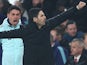 Arsenal manager Mikel Arteta and coach Carlos Cuesta react on January 15, 2025