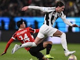 Dusan Vlahovic (Juventus) and Tijjani Reijnders (AC Milan) vie for the ball on January 3, 2025