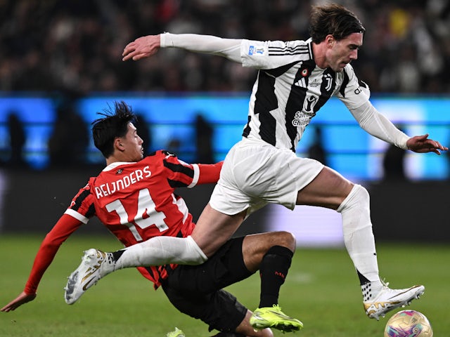 Dusan Vlahovic (Juventus) and Tijjani Reijnders (AC Milan) vie for the ball on January 3, 2025