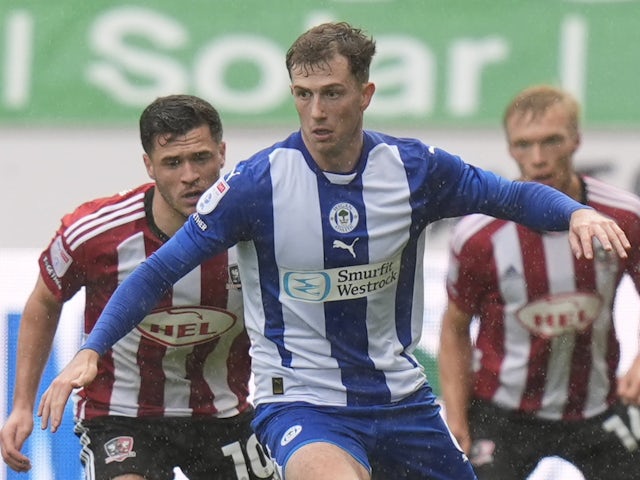 Jensen Weir of Wigan Athletic in action against Exeter City on September 28, 2024