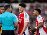 Arsenal's Myles Lewis-Skelly and Declan Rice remonstrate with referee Michael Oliver on January 25, 2025