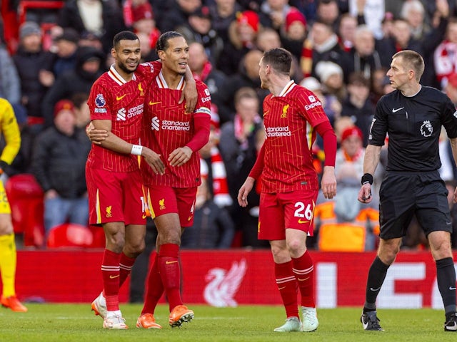 Cody Gakpo of Liverpool celebrates scoring against Ipswich Town with teammates, on January 2025