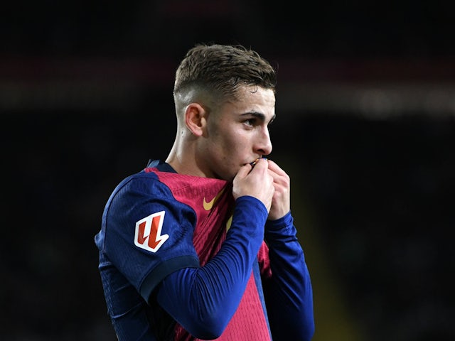 Barcelona's Fermin Lopez kisses the badge against Valencia on January 26, 2025