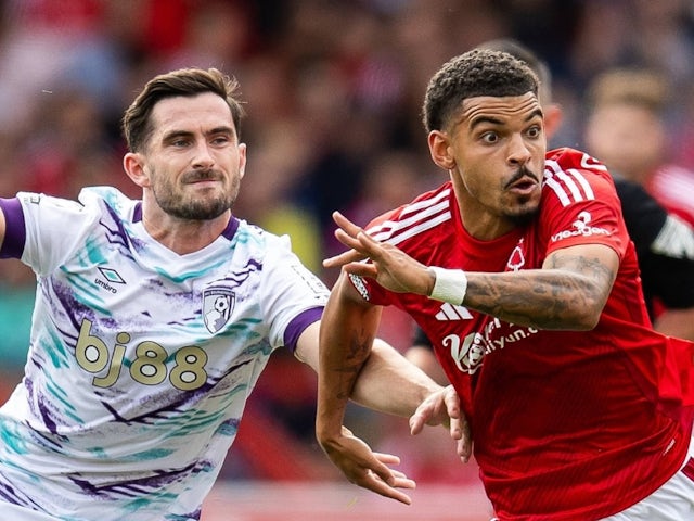 Bournemouth's Lewis Cook in action with Nottingham Forest's Morgan Gibbs-White on August 17, 2024