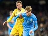 Cole Palmer of Manchester City holds off Ignace Van Der Brempt of Club Brugge on November 3, 2021