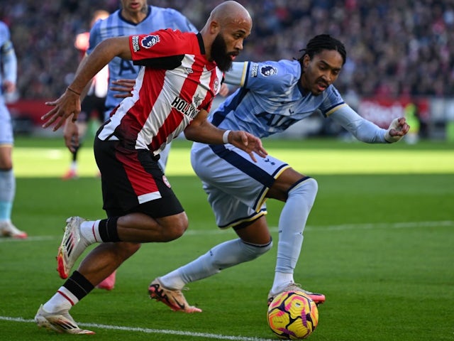 Djed Spence of Tottenham Hotspur defends Brentford's Bryan Mbeumo on February 2, 2025