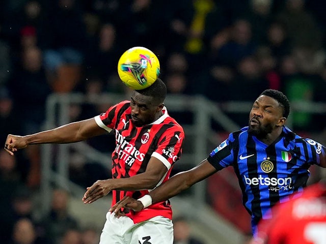 AC Milan's Fikayo Tomori fights for the ball with Inter Milan's Marcus Thuram during their sides' Serie A match, on February 2, 2025