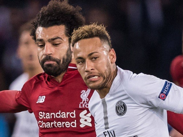 Liverpool's Mohamed Salah in action with Neymar (Paris Saint-Germain) on November 28, 2018