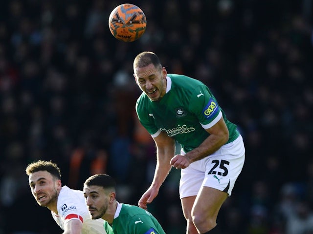 Nikola Katic of Plymouth Argyle challenges for the ball during his side's match against Liverpool, on February 9, 2025