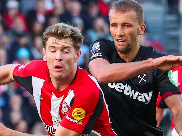 Nathan Collins of Brentford is put under pressure by Tomas Soucek of West Ham United on September 28, 2024