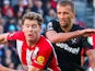 Nathan Collins of Brentford is put under pressure by Tomas Soucek of West Ham United on September 28, 2024