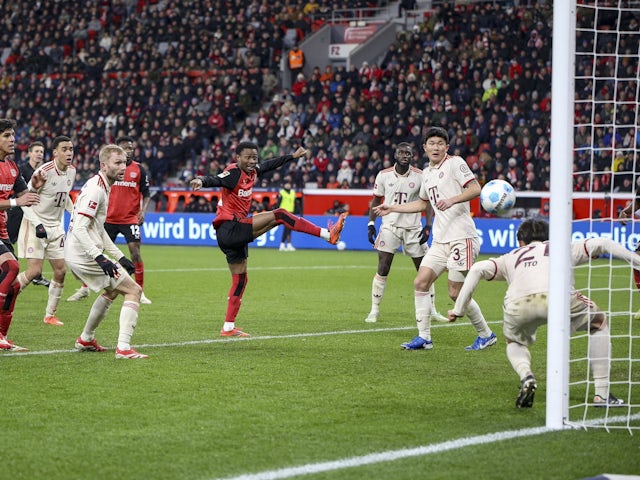 Bayern Munich's Hiroki Ito clears the ball off the line after an effort from Bayer Leverkusen's Nathan Tella on February 15, 2025