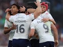 France's Antoine Dupont celebrates with teammates after scoring a try in the Six Nations on February 23, 2025