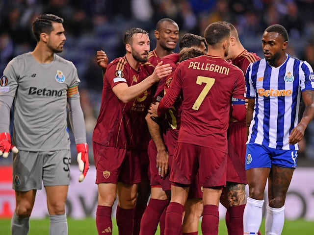 Roma celebrate scoring against Porto on February 13, 2025