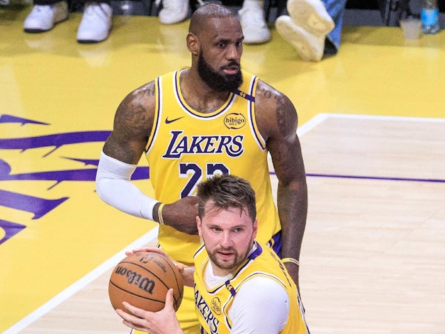  Luka Doncic 77 of the Los Angeles Lakers wins a rebound with LeBron James 23 in the background on February 24, 2025